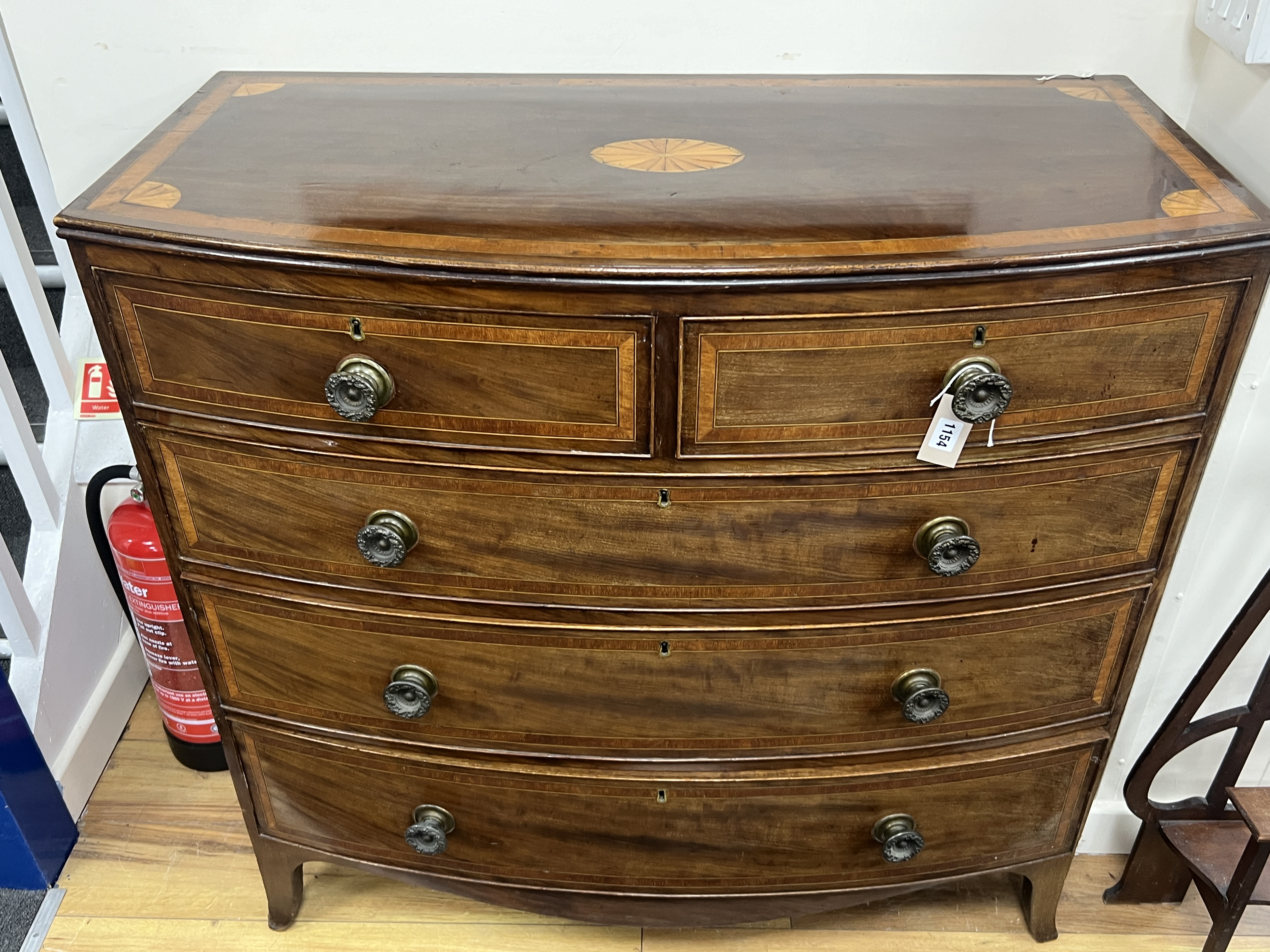 A Regency inlaid mahogany bow front chest, width 108cm, depth 52cm, height 104cm